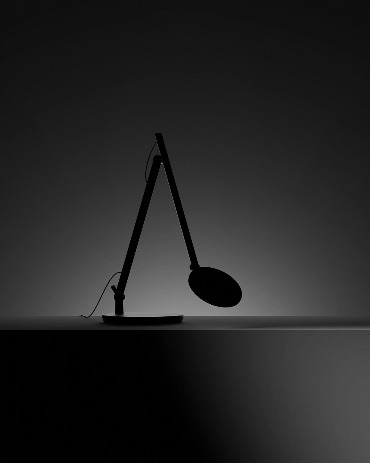 Humanscale Nova task light. Dark reveal image.